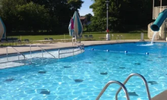 Swimming pool with a slide into the water