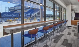 Hightop seating outlooking to the Tom Benson Hall of Fame field