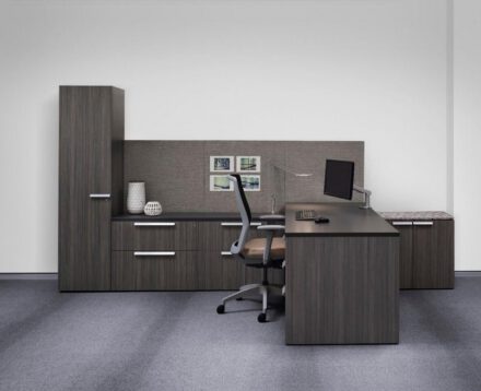 A classic storage workwall with adjoining worksurface makes the most of the compact private office