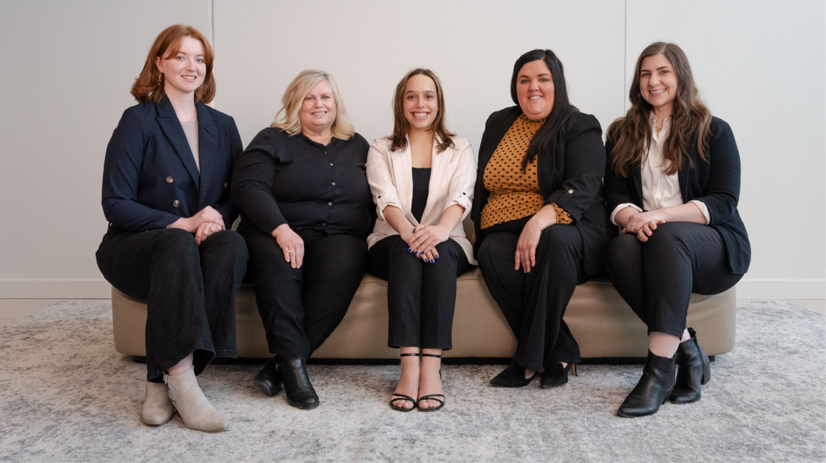 Group of business professionals looking at the camera smiling