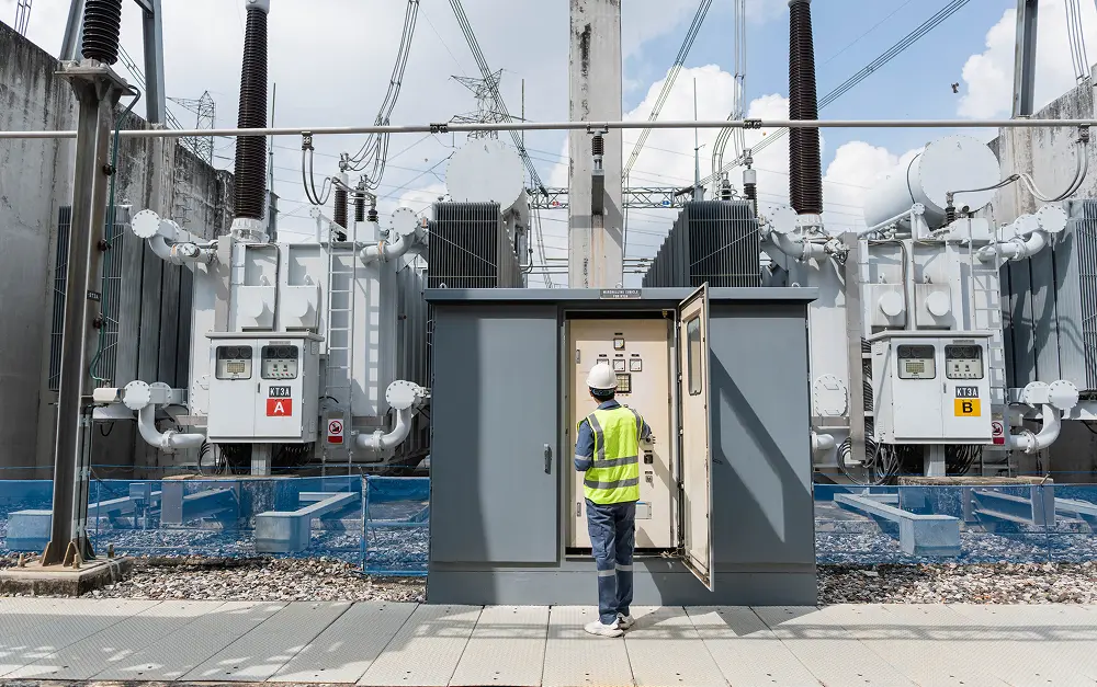 Project manager inspecting power generation infrastructure