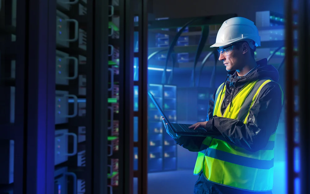 Technician reviewing data center infrastructure for Welty Generation Solutions services
